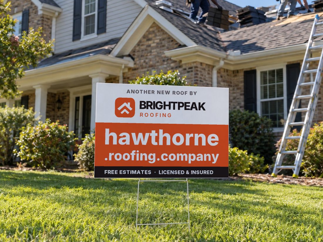 hawthorne.roofing.company on a yard sign in front of a house getting a new roof